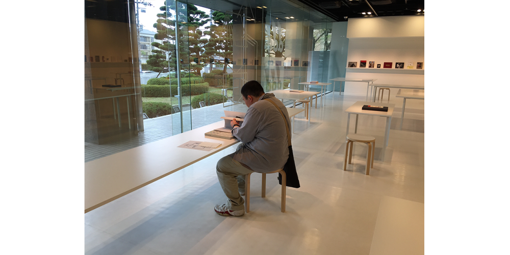 Exhibition Kyoto Man reading book